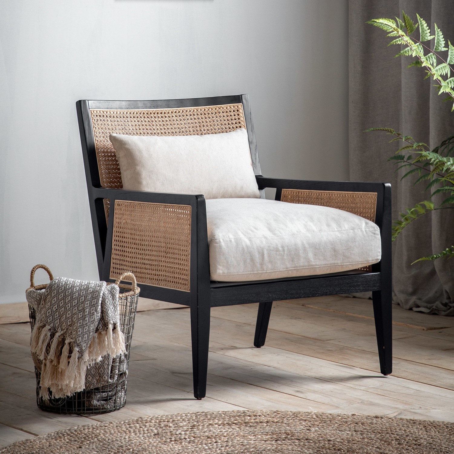 Photo of Cream rattan chair with cushions and black wood frame - caspian house