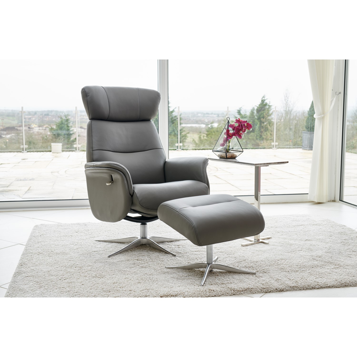 Photo of Dark grey leather swivel recliner armchair with footstool - houston