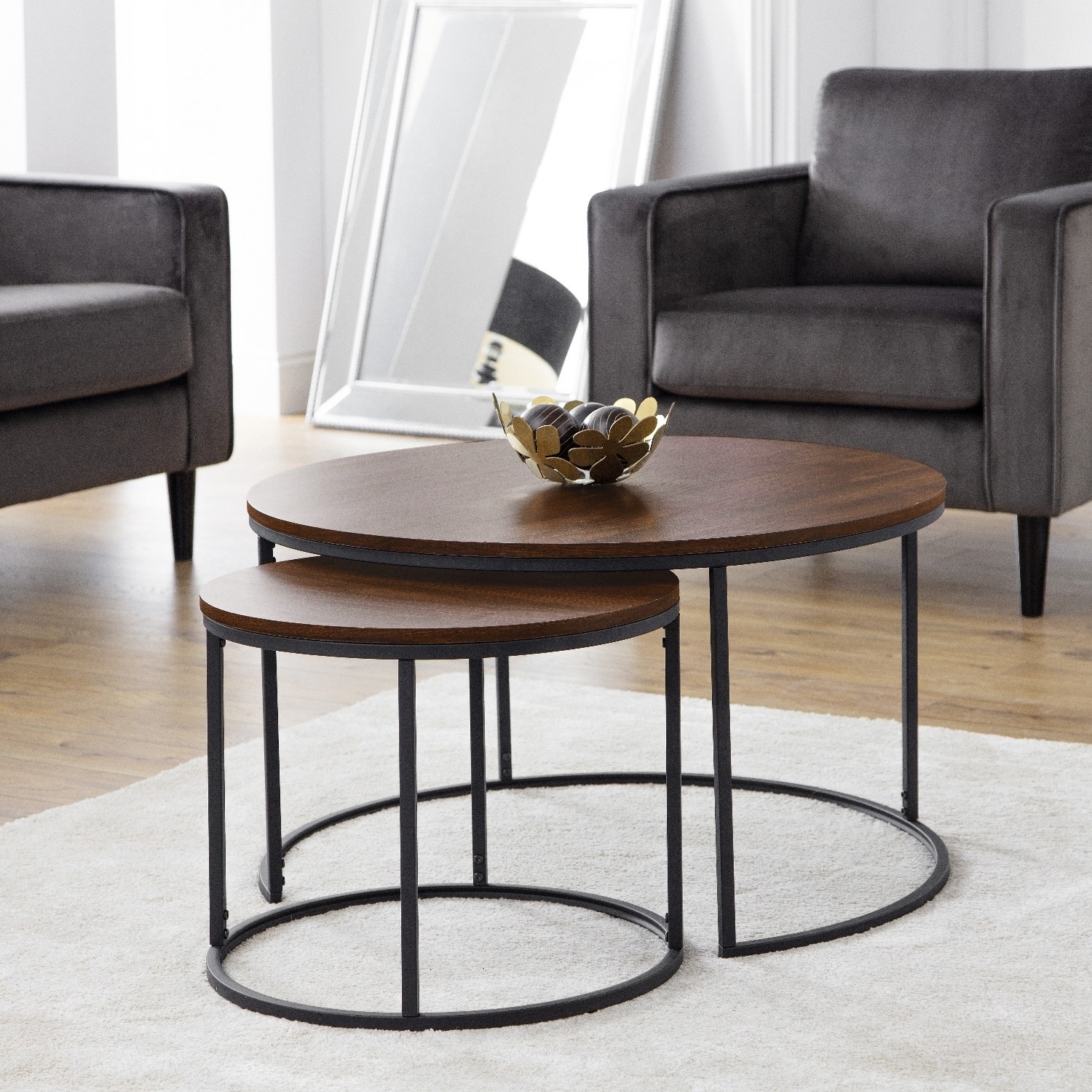 Photo of Round dark wood round nest of coffee tables with black metal base - julian bowen bellini