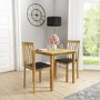 New Haven Light Oak Dining Table with 2 Slatted Back Black Chairs