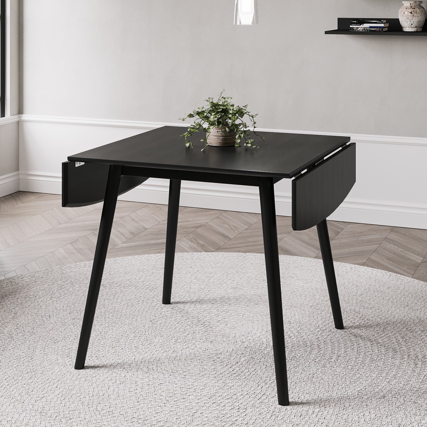 Photo of Small black wooden drop leaf dining table - seats 2-4 - olsen