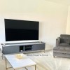 GRADE A2 - Dark Grey and Gold Curved TV Unit - TVs up to 70 inches - Olis