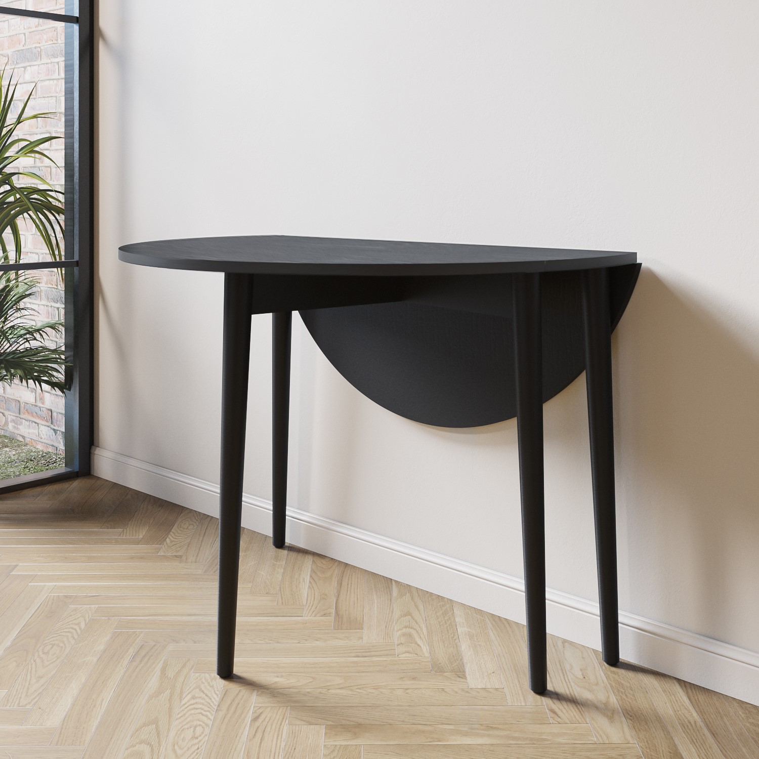 Photo of Small round black folding drop leaf dining table - seats 2-4 - rudy