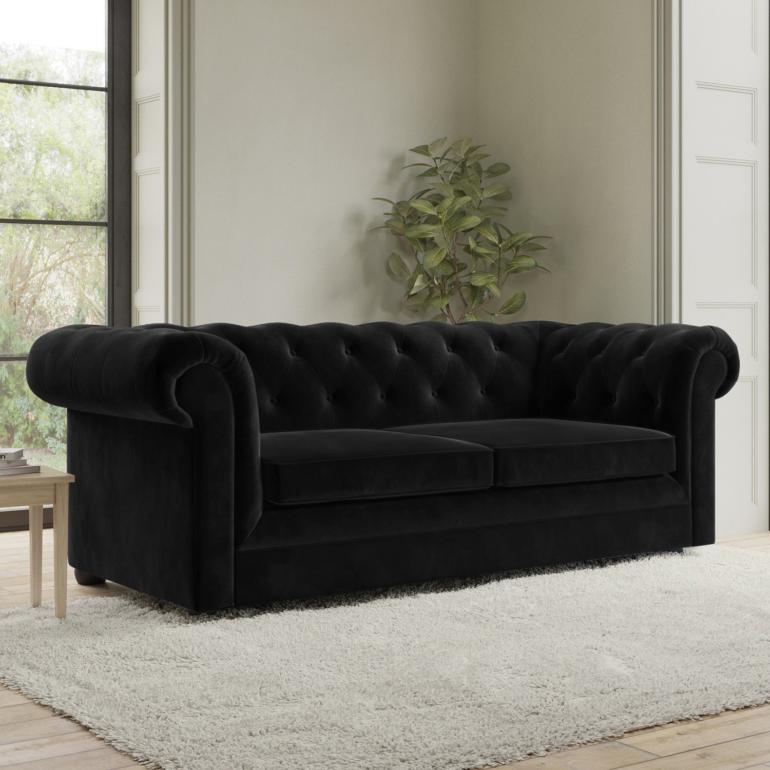 Photo of Black velvet chesterfield pull out sofa bed - seats 3 - bronte