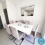 GRADE A2 - White Extendable Dining Table with High Gloss Finish - 6 Seater - Vivienne